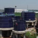 Rostfrei bolted steel liquid storage tanks installed at an industrial wastewater treatment site for efficient water management.